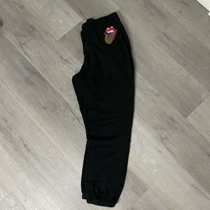 Black sweatpants with cheetah tounge/lips